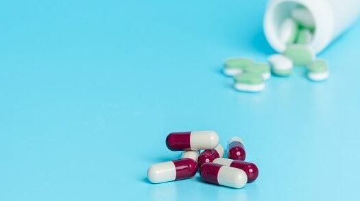 Concept of medicines, medical supplies placed on a blue background.